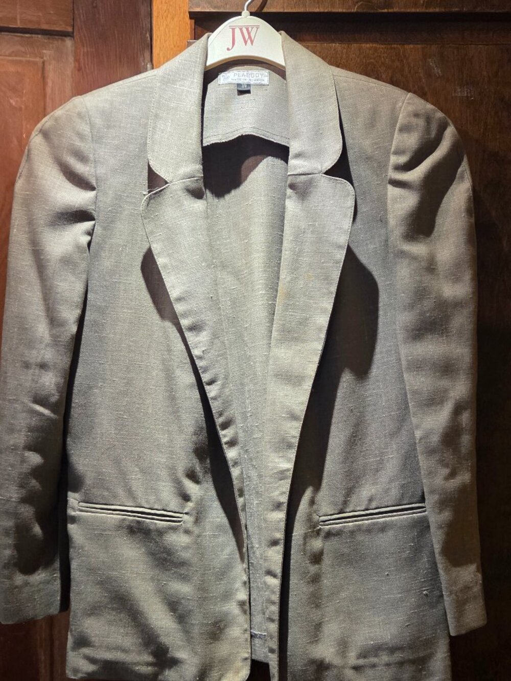 grey-green linen blazer features classic prominent notch lapels